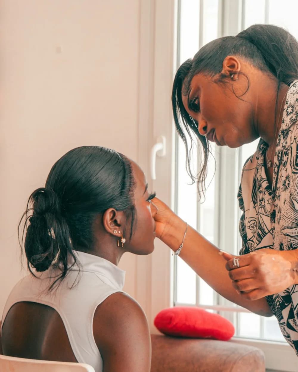 Makeup artist applying makeup to a client