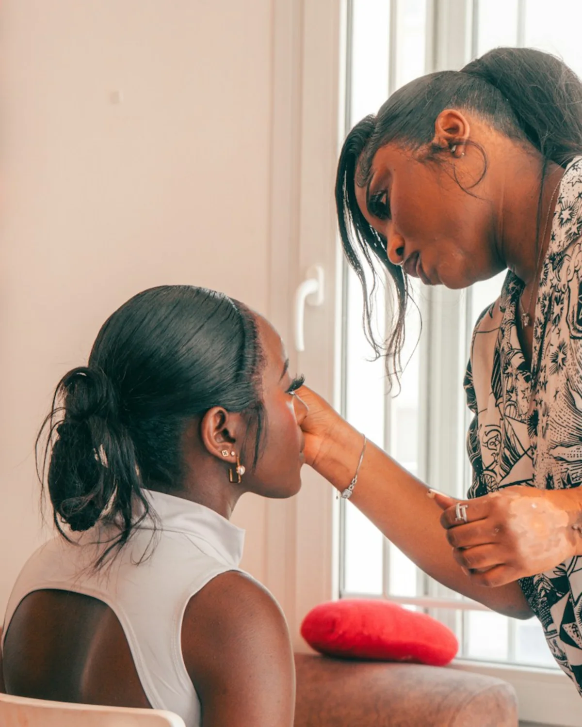 Makeup artist applying makeup to a client